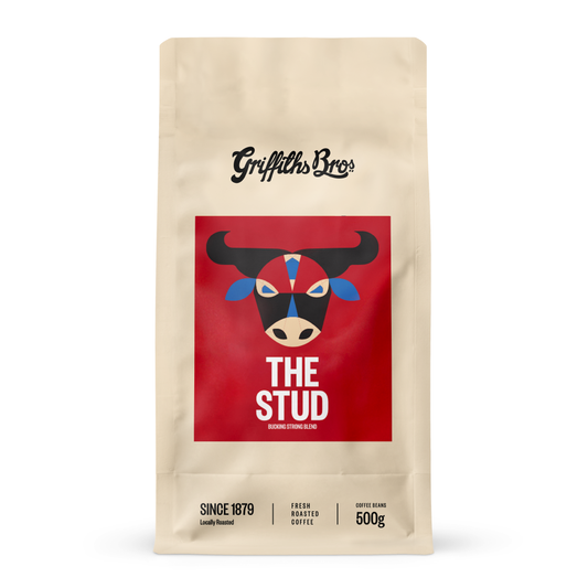 Griffiths Bros coffee package with a red label featuring a bull graphic on a beige background